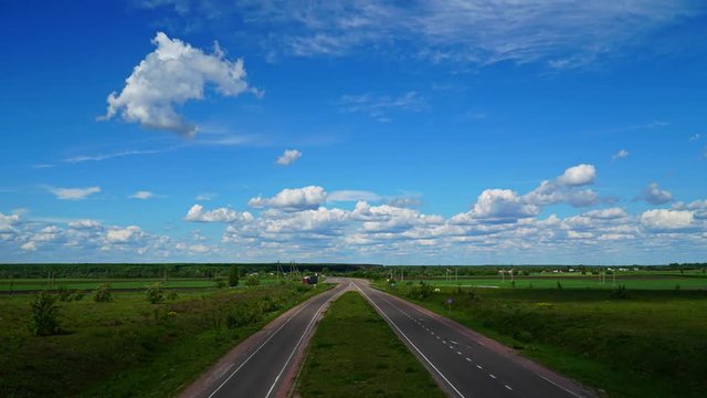 TimeLapse White Fluffy Clouds On The Road