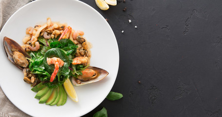 Warm salad with grilled seafood flat lay