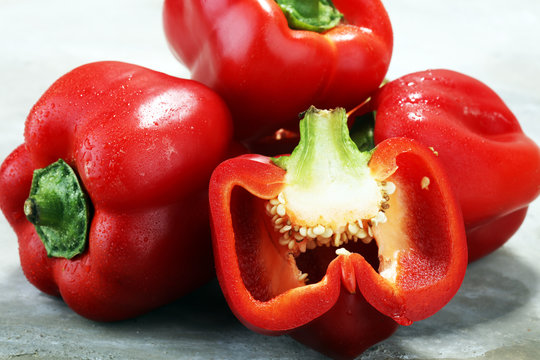 Fresh red bell pepper on grey background. raw vegetable