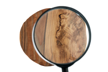 Study of a wooden texture through a magnifying glass. Isolated