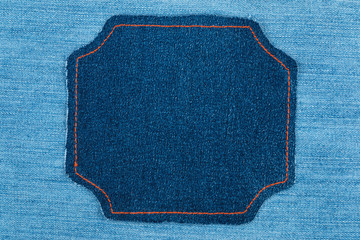 Frame made of denim fabric with yellow stitch on blue denim with space for your text.