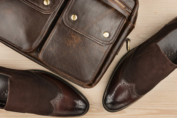 luxurious leather brown shoes with leather briefcase. Men's accessories.