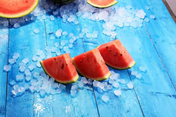 watermelon on blue background. juicy summer fruit in slices