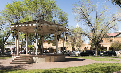 Gazebo in Old Town Albuquerque Plaza, and San Felipe de Niri Church. Old Town Albuquerque, New Mexico, USA.