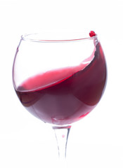 A glass with red wine on a white background. Isolate
