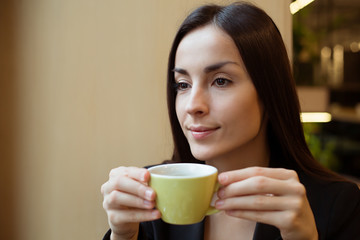 Relax Business Woman enjoying coffee in coffee shop while break