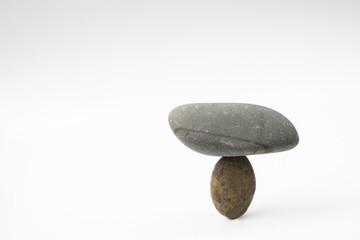 Balance different stone concepts together on a white background.