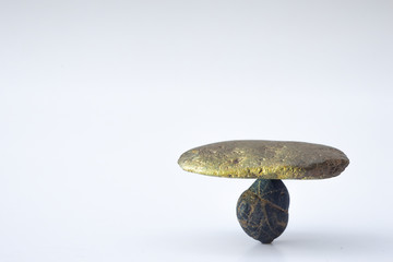 Balance different stone concepts together on a white background.