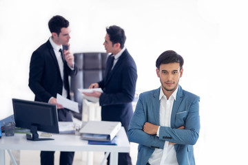 Young handsome businessman with blue suit