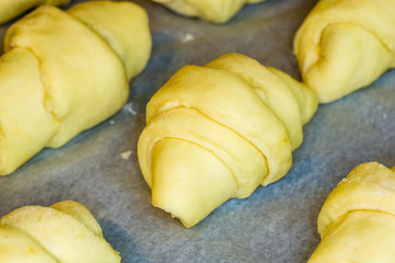 raw homemade croissants with sweet filling