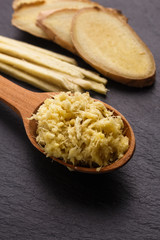 Ginger root on a dark stone background