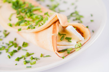 Pancake with brie cheese and chives