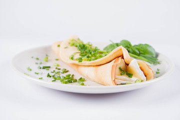 Pancake with brie cheese and chives