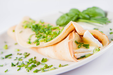 Pancake with brie cheese and chives
