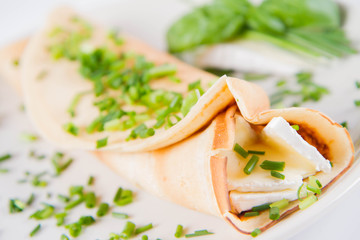 Pancake with brie cheese and chives