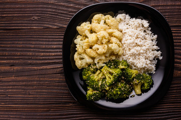 cauliflower and broccoli on a rustic background