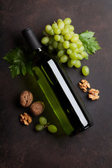 Wine bottle, grape and nuts