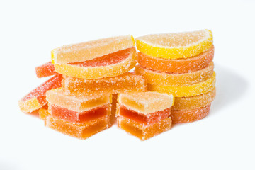 Colored fruit marmalade. Lemon, orange, grapefruit isolated on white background