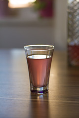 Liqueur in shot glass - Stock Image