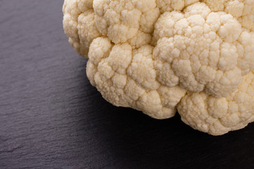 fresh cauliflower on a rustic wooden background