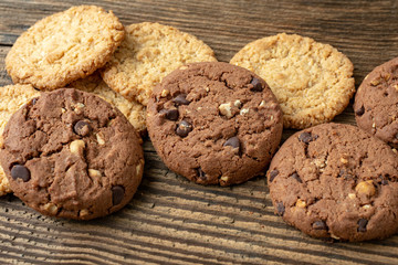 Various tasty cookies biscuits on wooden background