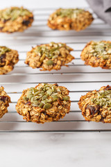 Vegan oatmeal cookies with dates and pumpkin seeds on the oven grill. Healthy vegan food concept.