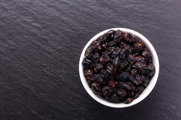 dried barberry berries on the rustic background