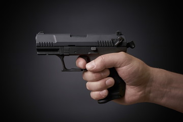 aiming handgun side view