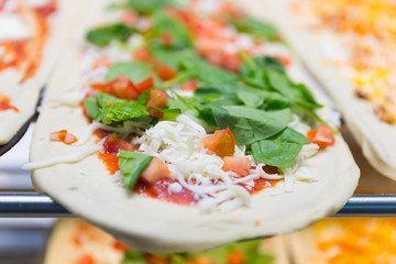 Uncooked pizza large cheese lunch or dinner crust seafood meat topping sauce. with bell pepper vegetables delicious tasty fast food italian traditional 