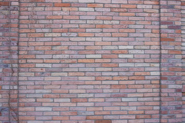 Decorative red brick wall. English style 