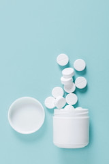 Pills spilling out of pill bottle