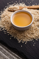fresh sesame seeds on a rustic background