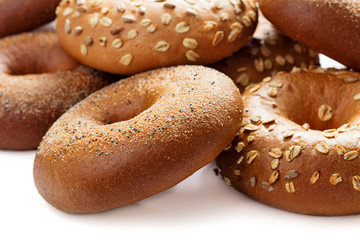 close-up view of heap of bagels isolated on white background