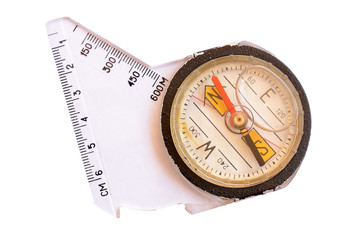 Old tourist compass with measuring scale isolated on white background
