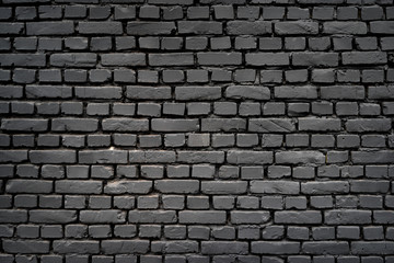 Black wall as background, texture of a black brick wall