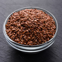 flaxseed and oil on a rustic background