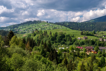 Aerial view of Carpathian mountains in summer. Village in the mountains.