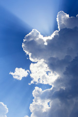Rays of light behind cloud
