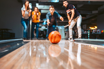 Friends having fun while bowling, happy hour - obrazy, fototapety, plakaty