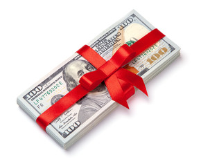 Concept, money as gift, win or bonus. Pile of 100 dollar bills is tied with red ribbon with bow....