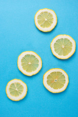 Sliced lemon on blue background