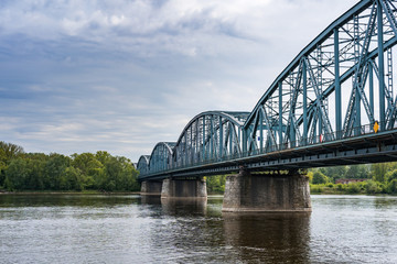 Fototapeta na wymiar Truss road bridge over Vistula river in Torun, Poland.