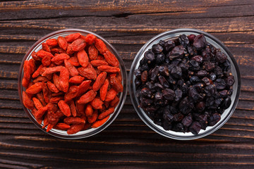 dried goji berries on a wooden rustic background