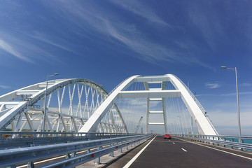 Fototapeta premium Cars go on the Crimean automobile bridge connecting the banks of the Kerch Strait