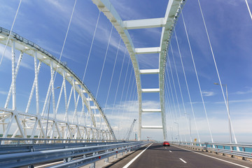 the Car rides on the road bridge connecting the banks of the Kerch Strait between Taman And Kerch