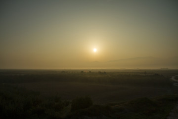 Foggy sunrise - Stock Image