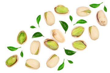 Pistachios with leaves isolated on white background with copy space for your text, top view. Flat lay pattern