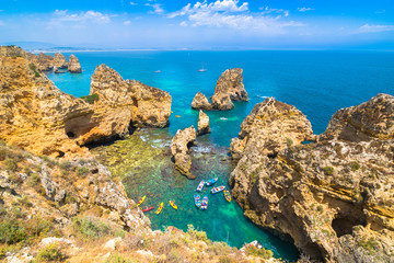 Lagos, Portugal - June, 09, 2015 - Tourists enjoy a beautiful sunny day to visit Ponta da Piedade.