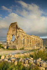 Fototapeta premium clouds and sunset around ruins of antique roman city in Morocco