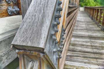 "Made to Last" The Americana Series close up of heavy duty bolts on a rustic wood bridge etal bolts  